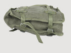 Side profile view of Polish Army canvas shoulder bag displaying sturdy gusset construction and metal buckles for securing contents.