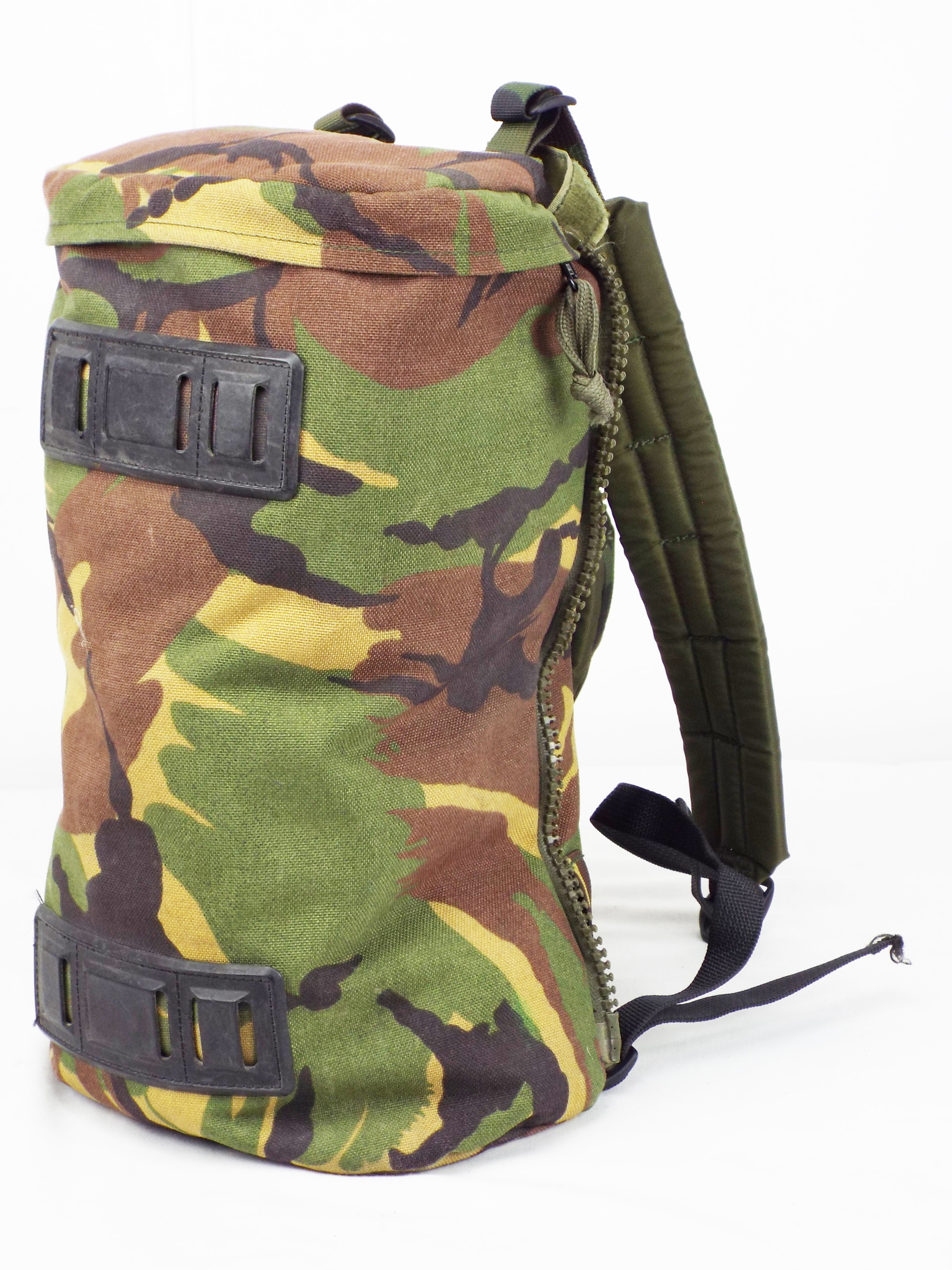 Angled shot of a single Dutch army surplus woodland camo side pocket with integrated shoulder straps.