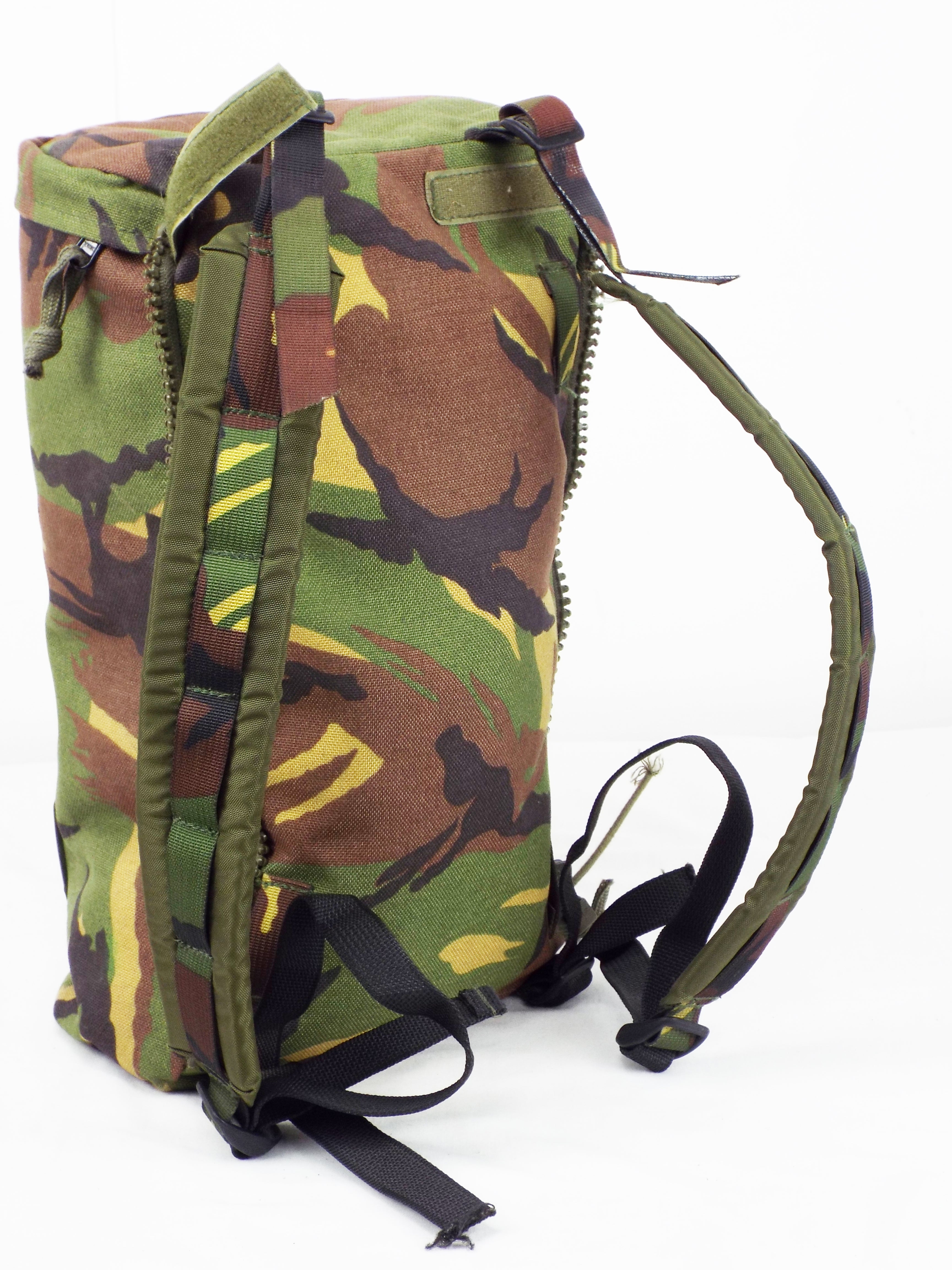 Side view of the Dutch Woodland camo side pocket showing the attachment zip and rugged shoulder strap construction.