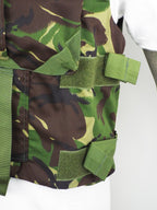 Side profile of the British DPM woodland camo flak vest, showing the adjustable green Velcro side straps designed for a secure torso fit.