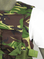 Detailed close-up of the shoulder and upper chest section of the British DPM body armour cover with visible reinforced stitching and camo pattern.