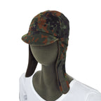 German Army Flecktarn cold weather hat with side ear flaps down, showing Velcro detail on a mannequin.