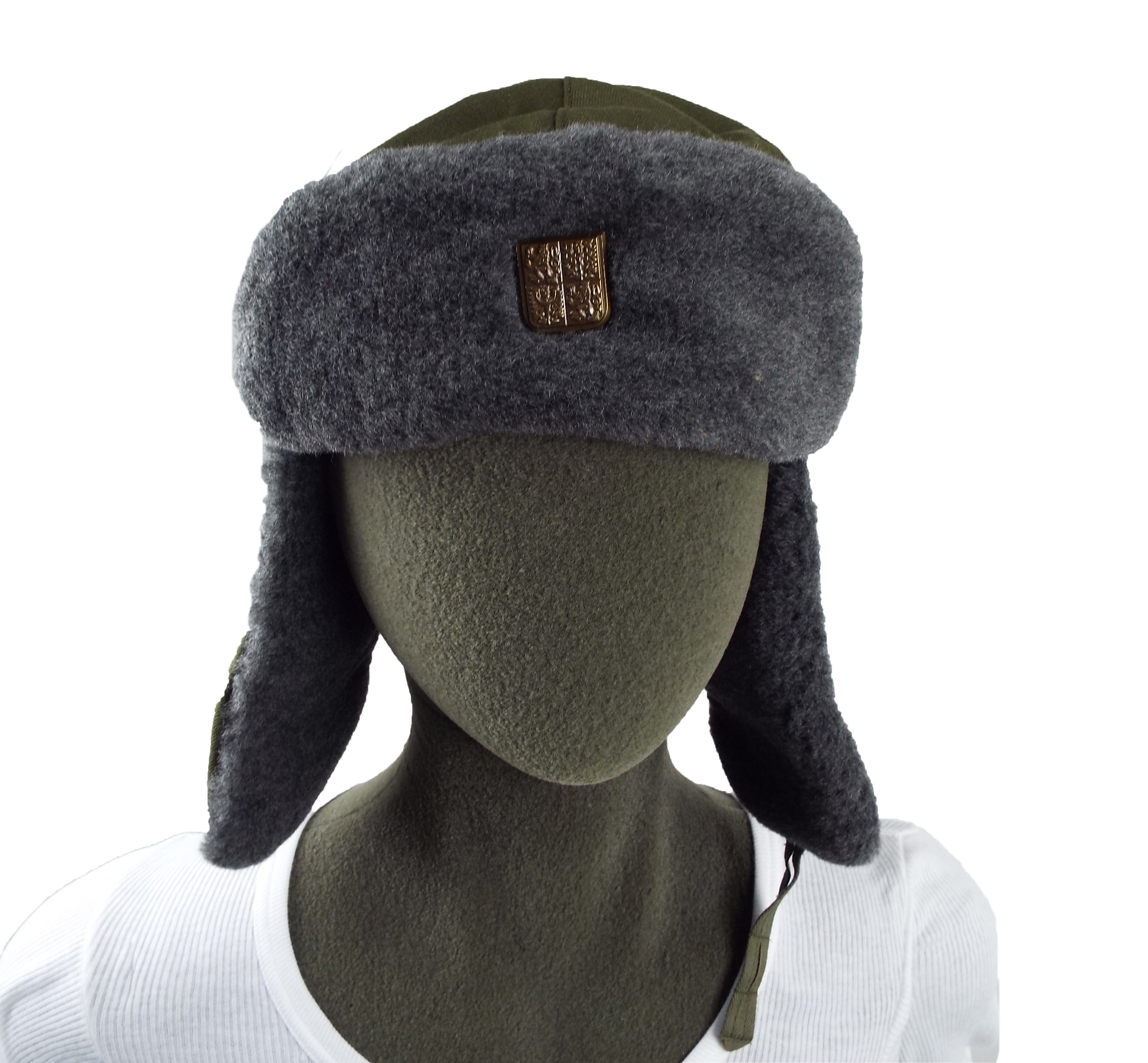 Front view of a Czech Ushanka winter hat on a mannequin, featuring ear flaps and a small metallic shield badge.