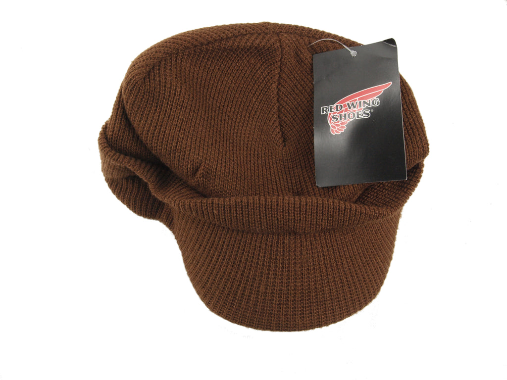 Top-down view of the brown Red Wing Shoes Radar beanie with the original brand hangtag still attached to the knit fabric.