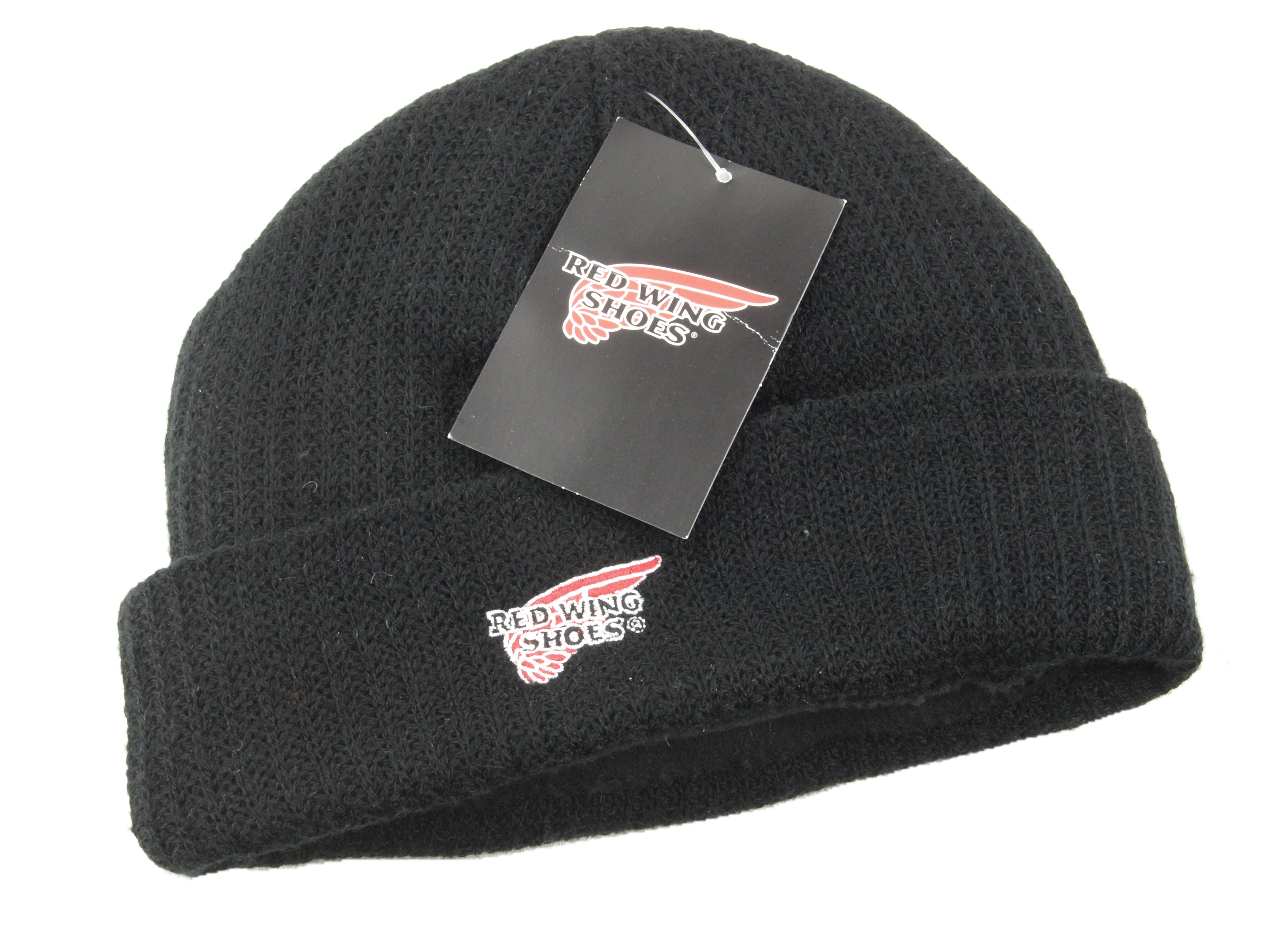 Black fleece-lined beanie hat folded flat, featuring an embroidered Red Wing Shoes logo and original brand tag attached.