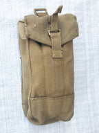 Close-up front view of a khaki cotton canvas British Army Mark III ammo pouch with a secure press stud fastener.