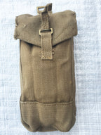 Front view of a durable WW2 era British Army Mark III canvas ammo pouch showing brass hardware and rugged texture.
