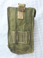 Rear view of an olive drab British Army Mark III ammo pouch showing the attachment loops for belt or webbing gear.