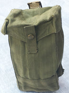 Side profile of a British Army Mark III ammo pouch in olive drab, highlighting the depth and durable construction of the surplus gear.