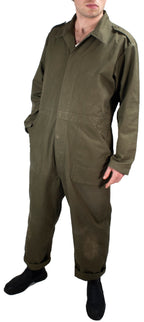 Three-quarter view of olive drab Dutch military coveralls, highlighting the durable cotton weave and front pocket design.