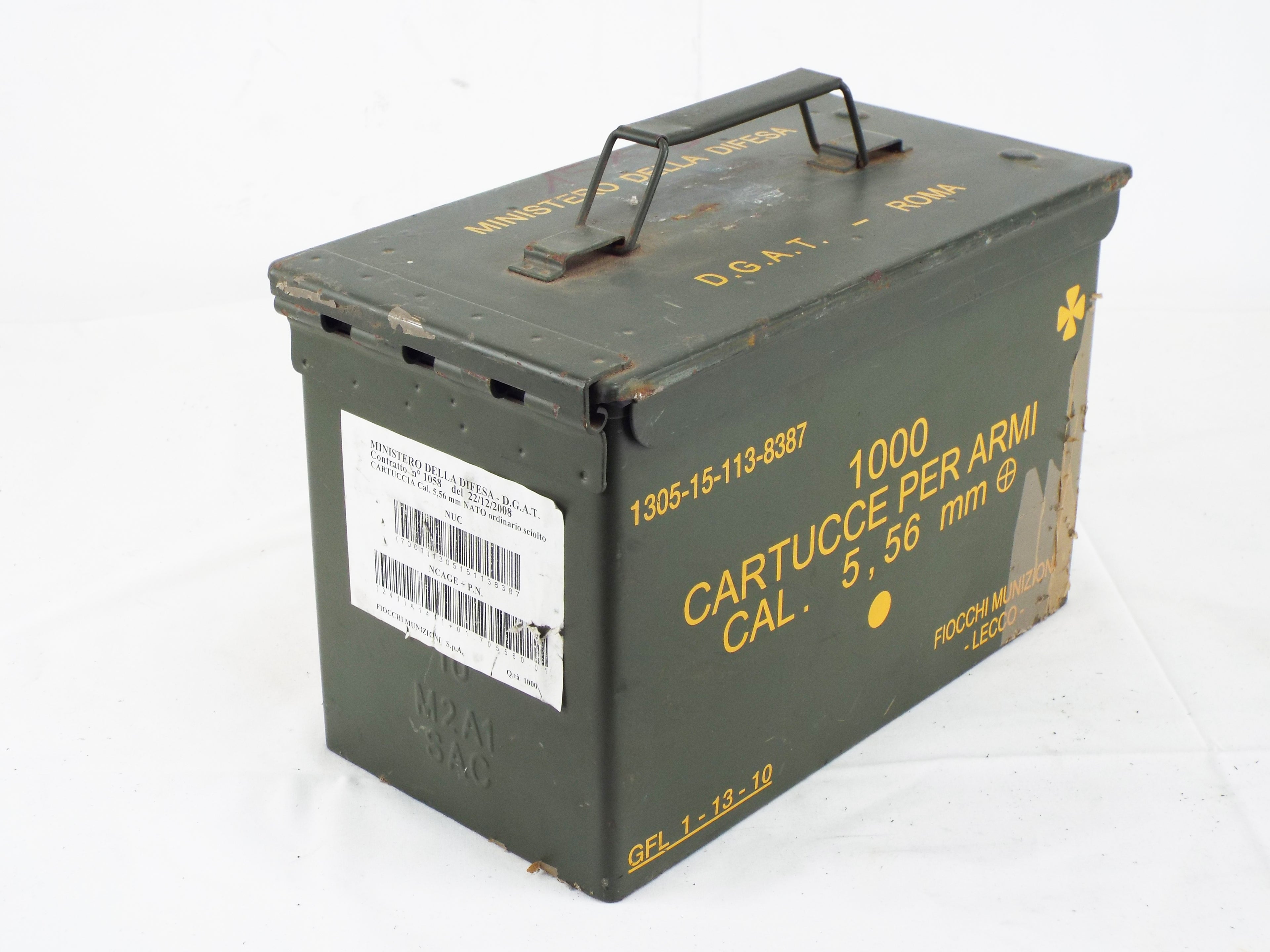 Grade 1 army surplus 5.56mm ammo box, olive green finish with original shipping labels, barcode, and steel hinge details.