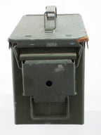 End profile view of a NATO olive green steel storage box, showing the robust locking swing catch and hinge mechanism.
