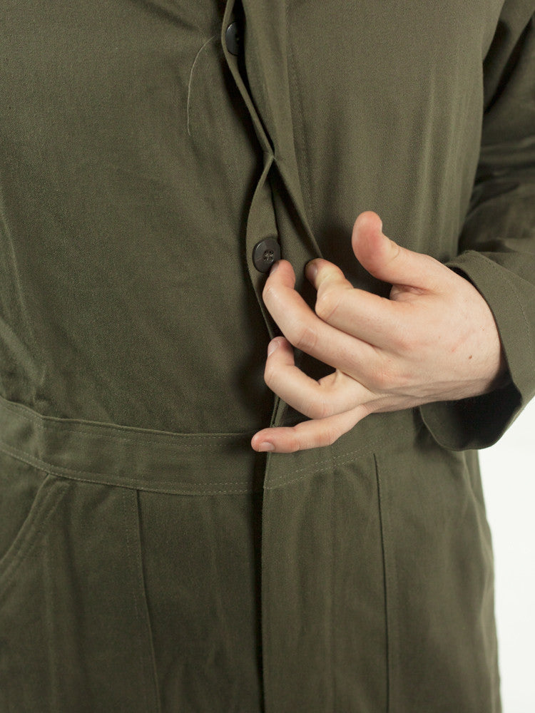 Detail view of the concealed button placket on Dutch Army overalls, designed to protect machinery from scratches.