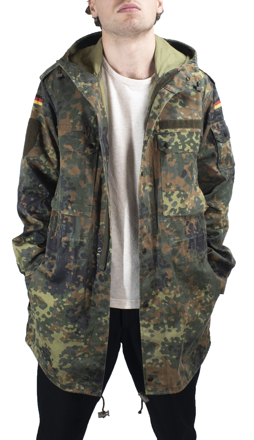 Detailed front view of the German military parka with hands in pockets, highlighting durable polycotton fabric.