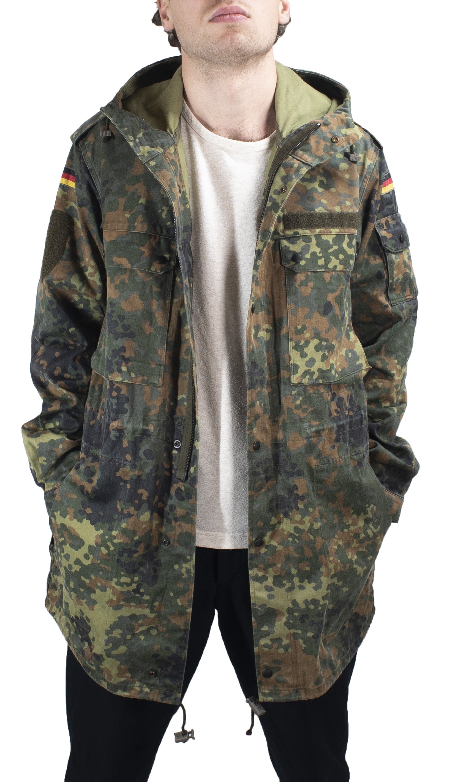 Detailed front view of the German military parka with hands in pockets, highlighting durable polycotton fabric.
